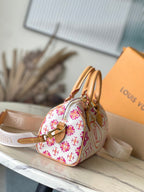 LOUIS VUITTON SPEEDY BANDOULIÈRE 20 IN CORAL MONOGRAM TILES CANVAS GOLD BUCKLE