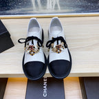 CHANEL COMBAT OXFORD SHOES IN WHITE WRINKLED CALFSKIN AND BLACK GROSGRAIN WITH FAUX PEARL