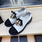 CHANEL COMBAT OXFORD SHOES IN WHITE WRINKLED CALFSKIN AND BLACK GROSGRAIN WITH FAUX PEARL