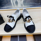 CHANEL COMBAT OXFORD SHOES IN WHITE WRINKLED CALFSKIN AND BLACK GROSGRAIN WITH FAUX PEARL