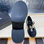 CHANEL COMBAT OXFORD SHOES IN BLACK WRINKLED CALFSKIN AND GROSGRAIN WITH FAUX PEARL