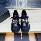 CHANEL COMBAT OXFORD SHOES IN BLACK WRINKLED CALFSKIN AND GROSGRAIN WITH FAUX PEARL