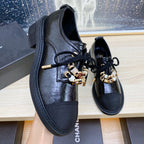CHANEL COMBAT OXFORD SHOES IN BLACK WRINKLED CALFSKIN AND GROSGRAIN WITH FAUX PEARL