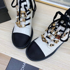 CHANEL COMBAT BOOTS IN WHITE WRINKLED CALFSKIN AND BLACK GROSGRAIN WITH FAUX PEARL
