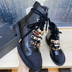 CHANEL COMBAT BOOTS IN BLACK WRINKLED CALFSKIN AND GROSGRAIN WITH FAUX PEARL
