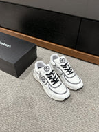 CHANEL CLASSIC TRAINER IN WHITE MIX BLACK FABRIC