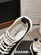 CHANEL LACE-UP SNEAKERS IN BLACK CANVAS