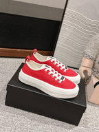 CHANEL LACE-UP SNEAKERS IN CHERRY RED CANVAS
