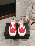 CHANEL LACE-UP SNEAKERS IN CHERRY RED CANVAS