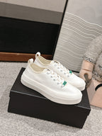 CHANEL LACE-UP SNEAKERS IN WHITE CANVAS