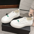 CHANEL LACE-UP SNEAKERS IN WHITE CANVAS