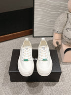 CHANEL LACE-UP SNEAKERS IN WHITE CANVAS
