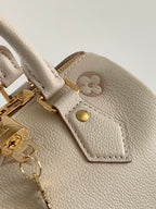 LOUIS VUITTON SPEEDY BANDOULIÈRE 21 IN WHITE AND PINK MONOGRAM CANVAS
