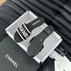 CHANEL Woven Embroidered Letter Slippers Black White