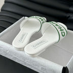 CHANEL Woven Embroidered Letter Slippers White Green