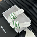 CHANEL Woven Embroidered Letter Slippers White Green