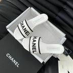 CHANEL Woven Embroidered Letter Slippers White Black