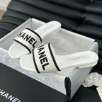 CHANEL Woven Embroidered Letter Slippers White Black
