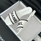 CHANEL Woven Embroidered Letter Slippers White Black