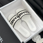 CHANEL Woven Embroidered Letter Slippers White Black
