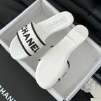 CHANEL Woven Embroidered Letter Slippers White Black