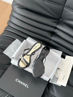 CHANEL PEARL SANDAL IN BLACK AND GOLD LAMBSKIN 35 MM