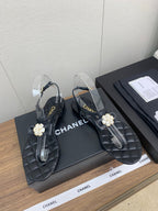 CHANEL THONG SANDAL IN BLACK LAMBSKIN WITH PEARL FLOWER