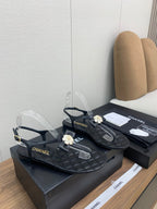 CHANEL THONG SANDAL IN BLACK LAMBSKIN WITH PEARL FLOWER