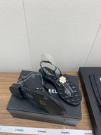 CHANEL THONG SANDAL IN BLACK LAMBSKIN WITH PEARL FLOWER