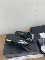 CHANEL BOW SLIPPERS IN BLACK LAMBSKIN WITH RHINESTONES