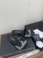 CHANEL BOW SLIPPERS IN BLACK LAMBSKIN WITH RHINESTONES