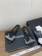 CHANEL BOW SLIPPERS IN BLACK LAMBSKIN WITH RHINESTONES