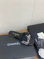 CHANEL BOW SLIPPERS IN BLACK LAMBSKIN WITH RHINESTONES