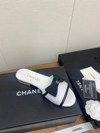 CHANEL BOW SLIPPERS IN WHITE LAMBSKIN