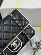 CHANEL QUILTED FLAP BAG WITH WHITE TRIM 19 IN BLACK LAMBSKIN