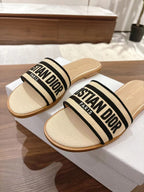 DIOR DWAY SLIDES IN BEIGE AND BLACK TECHNICAL FABRIC