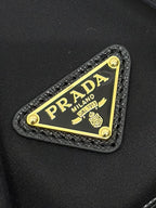 PRADA BUCKET BAG 19 IN BLACK RE-NYLON AND CALFSKIN HANDLE