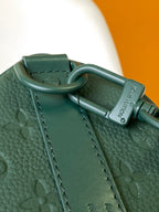 LOUIS VUITTON KEEPALL BANDOULIÈRE 25 IN FOREST GREEN MONOGRAM EMBOSSED CALFSKIN