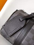 LOUIS VUITTON LV 25S KEEPALL BANDOULIÈRE 25 BAG IN DAMOFLAGE BLACK CALFSKIN