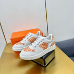 HERMES FREE SNEAKER IN WHITE CALFSKIN AND "H EN BIAIS" ORANGE CANVAS