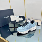 CHANEL TRAINERS SNEAKER IN LIGHT BLUE CALFSKIN WITH BLACK EMBROIDERED