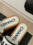 CHANEL THICK SOLE LETTER SLIPPERS IN WHITE SHEEPSKIN