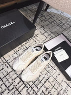 CHANEL CLASSIC SNEAKERS IN WHITE SHEEPSKIN