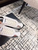 CHANEL CLASSIC SNEAKERS IN SILVER SHEEPSKIN