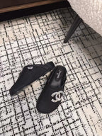 CHANEL FLAT MULES IN BLACK CALFSKIN
