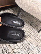 CHANEL FLAT MULES IN BLACK CALFSKIN