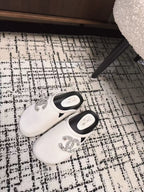 CHANEL FLAT MULES IN WHITE CALFSKIN