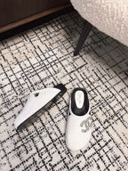 CHANEL FLAT MULES IN WHITE CALFSKIN