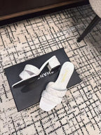 CHANEL MID HEEL MULES IN WHITE SHEEPSKIN
