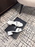 CHANEL MID HEEL MULES IN WHITE SHEEPSKIN